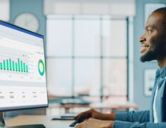 Man studies website analytics on computer.